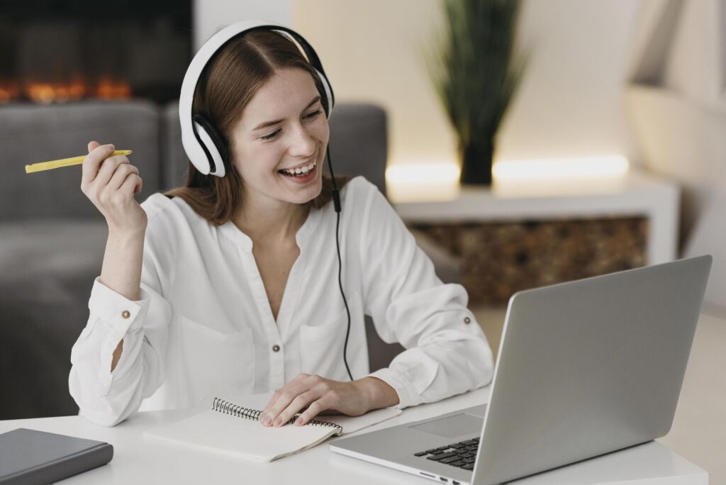 happy-teacher-talking-with-her-students-online
