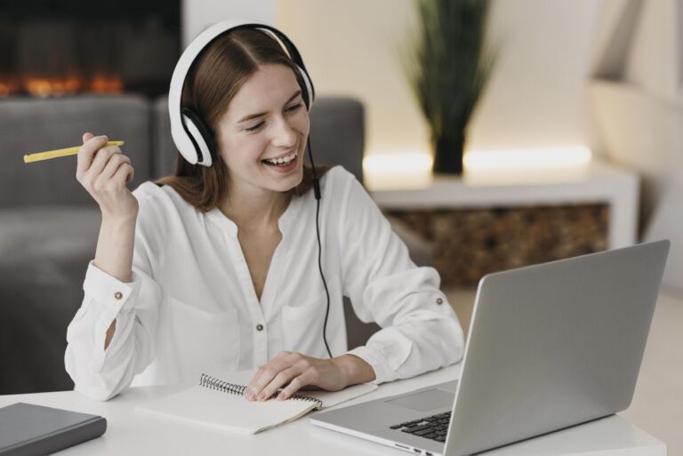 happy-teacher-talking-with-her-students-online