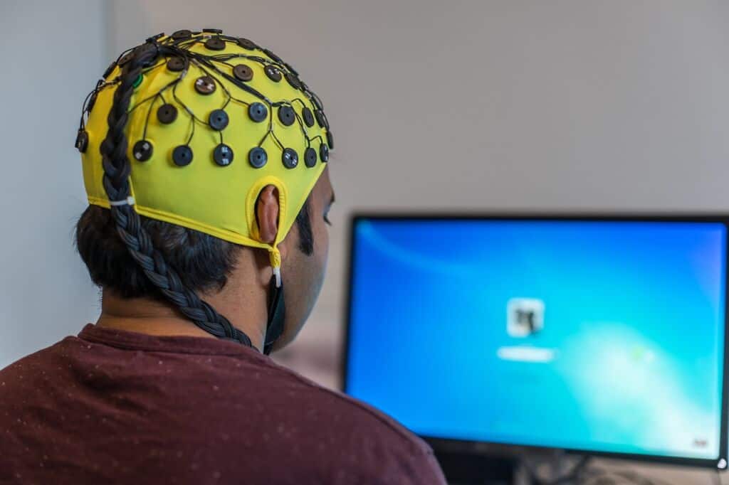 man using a brain scanning device