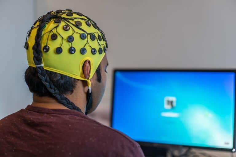 man using a brain scanning device