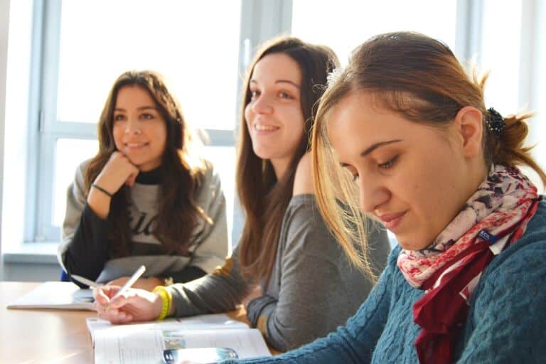 Three female students at a table